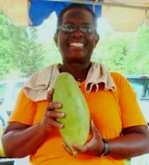 Gloria F. Neale-Felix and one of her mega mangoes at Mango Melee 2011.
