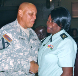 Lt. Col. Brian O'Reilly congratulates Staff Sgt. Agnes Lindsay on her service.