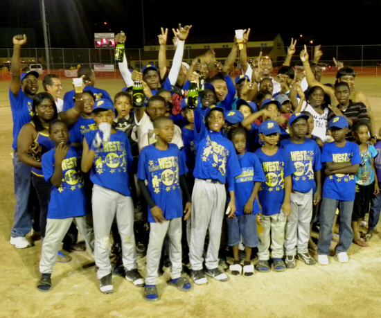 Elmo Plaskett West 9-10 and 11-12 Little Leaguers celebrate with fans at the D.C. Canegata Ball Park.  (click to enlarge)