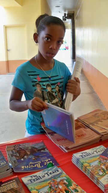 Third grader Alicia Joseph looks for just the right book.