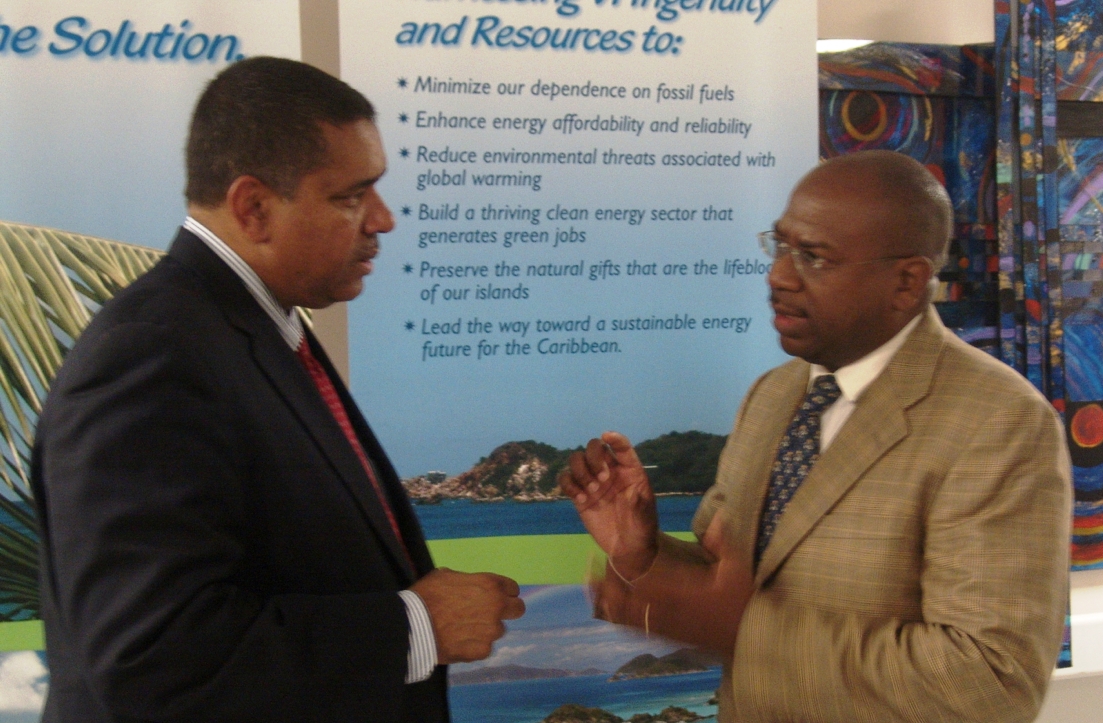 Gov. John deJongh Jr. and former Sen. Basil Ottley, now a representative of the U.S. Department of the Interior, talk after the governor's speech at the renewable energy conference.