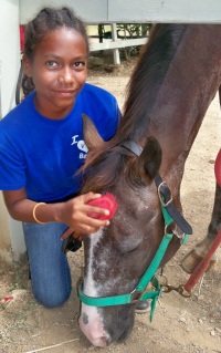 Nyama Gibbs, 10, grooms Muchi. 