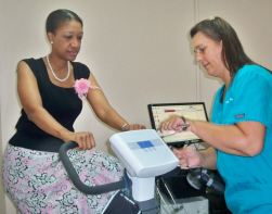 Darlene Baptiste (left) on the cycle ergometer used in a cardiopulmonary exercise test and Kim Sherman R.N. 