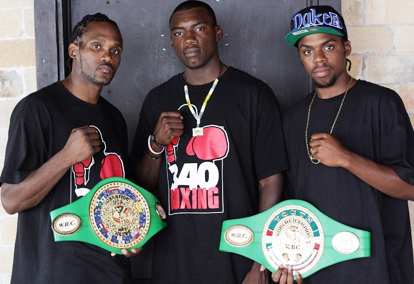 Boxers Samuel Rogers (left), Julius Jackson, and John Jackson promote the opening of a new gym.