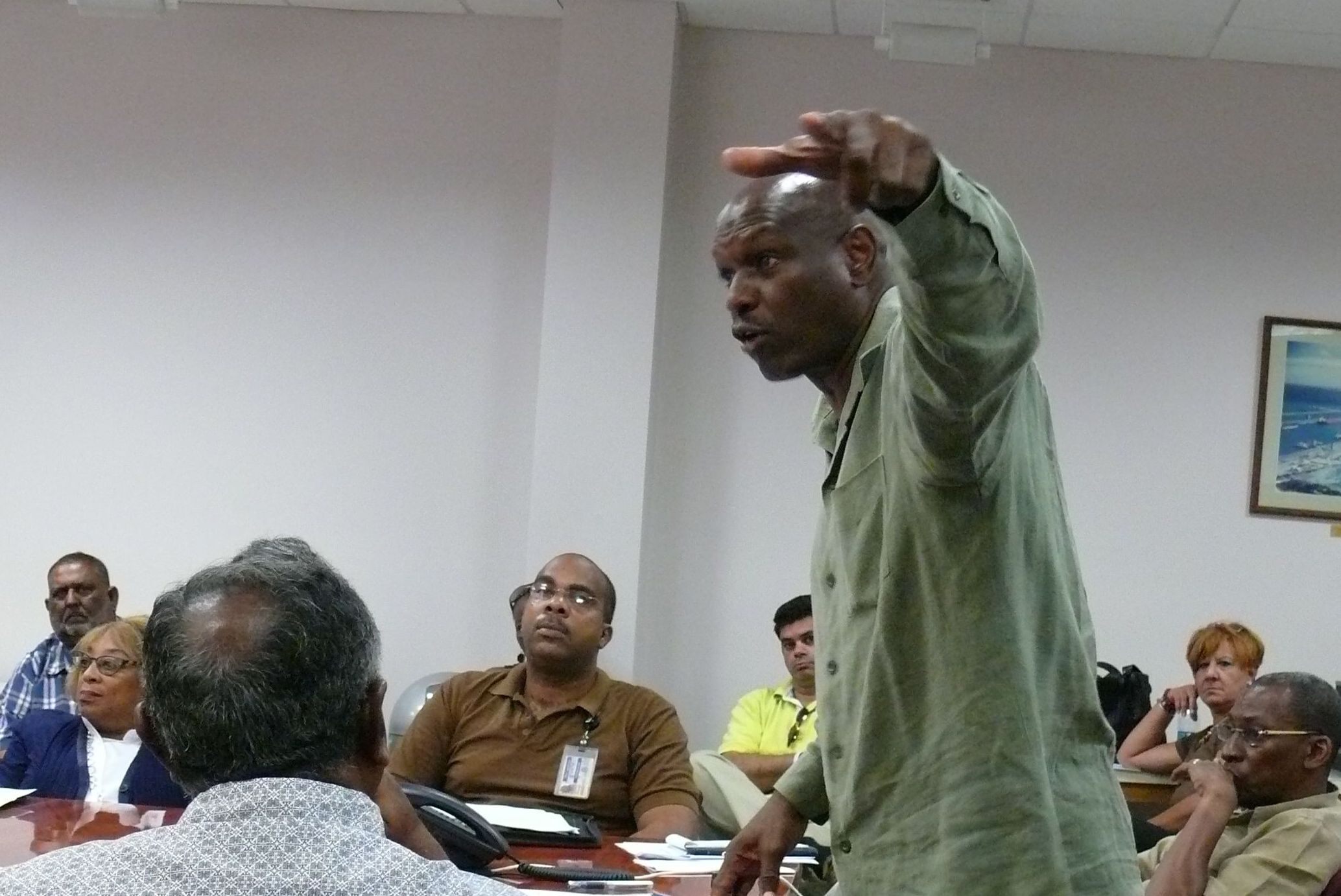 Sen. Carlton "Ital" Dowe speaking with St. Croix gas station owners Monday.