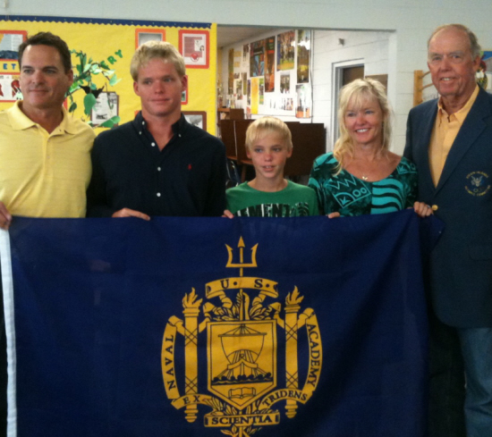 Bryson Mays and family display a Naval Academy flag; from left, father Brent, Bryson, brother Matthew, mother Jodie and grandfather Hans Lawaetz.