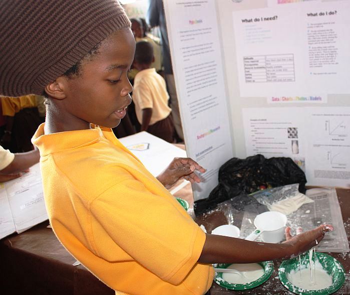 Shakari Brooks, 8, demonstrates colloidal mixtures.