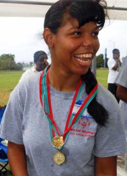 Chrystil Harper celebrates after winning a medal in the 25-meter run.