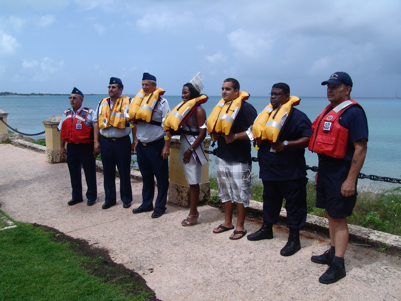 Saturday in Frederiksted, from left, Lee Elvins, Gregory Worrell, John Harrison, Miss Frederiksted Deidre DuBois, Michael Nason, Mervyn Constantine Jr., and George Kalemba wear their life jackets as part of the "Ready, Set, Wear It!" campaign.