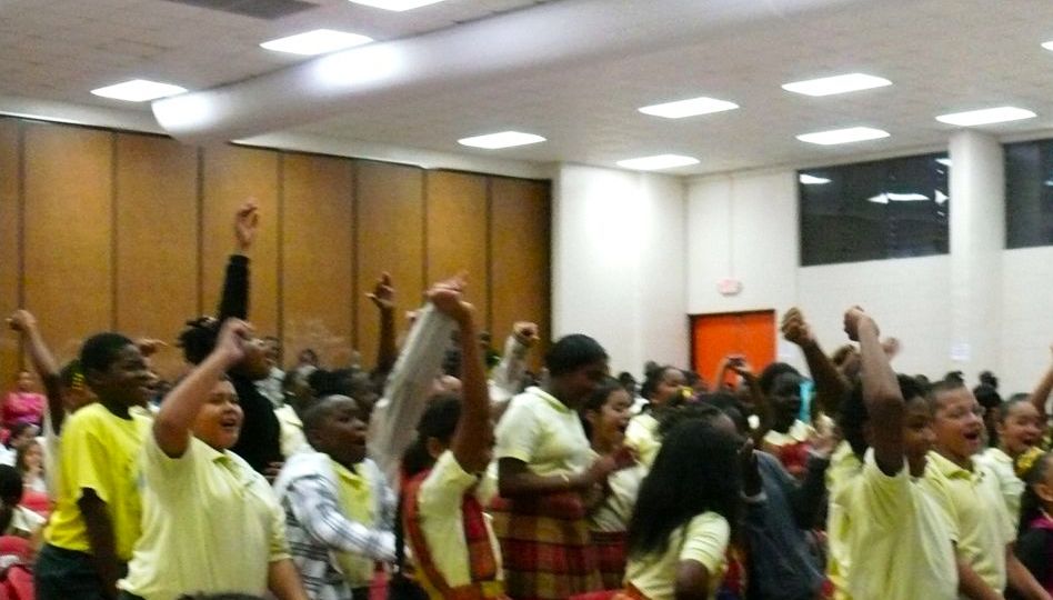 Students leap to answer questions during Coole School graduation ceremonies on St. Croix.