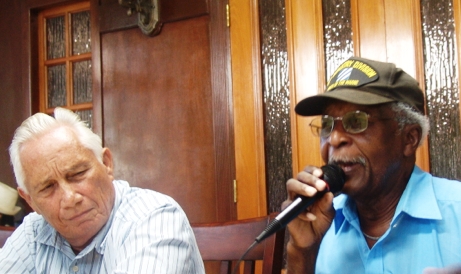 George Flores listens as Al Franklin talks about the benefits of the proposed sports complex in Frederiksted.