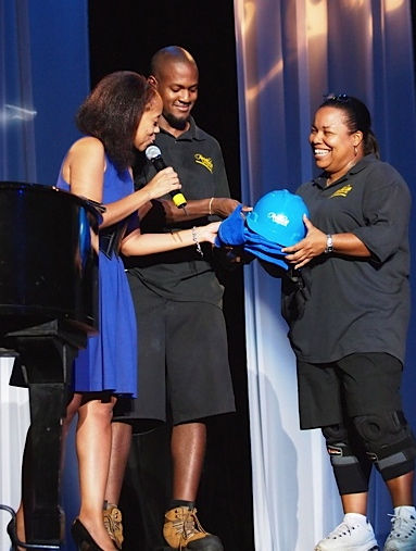 Denise Humphries gets gifts from Dionne Jackson. (Photo courtesy the Reichold Center)