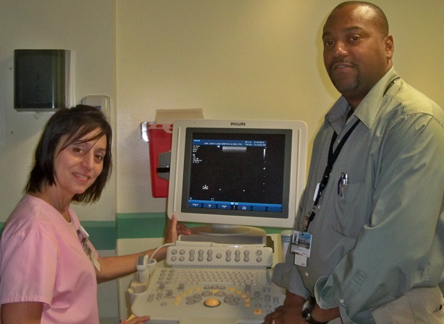 Ultrasound technician Velma Vasquez and David Williams, director of Imaging Services at the hospital, with the ultrasound machine. 