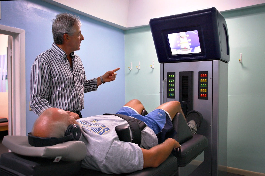 Chiropractor Kelly Greer talks with a patient at the Caribbean Health and Fitness Complex at Beeston Hill on St. Croix.