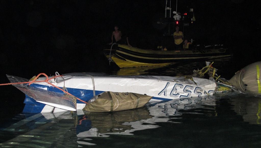 Plane in the water adjacent to Cyril E. King Airport.