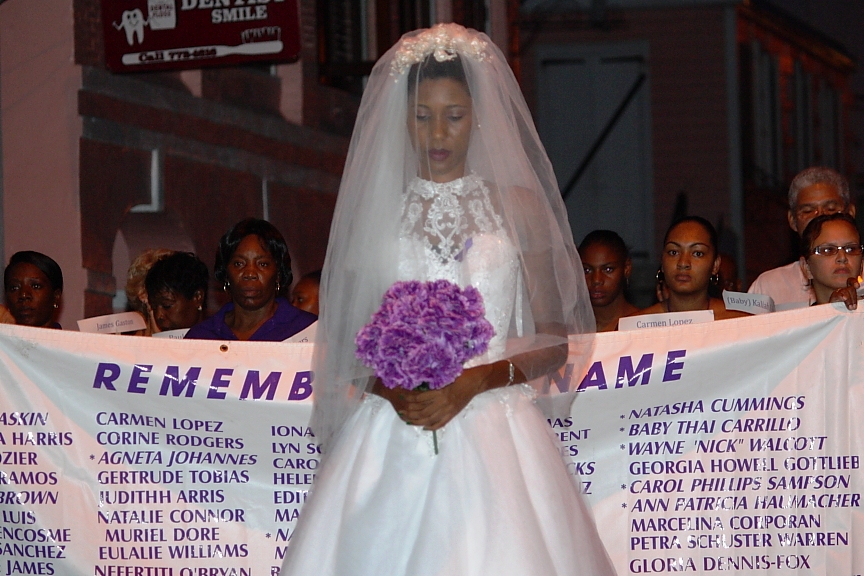 In the 2012 Take Back the Night event on St. Croix, Reshauna Christopher marches in a wedding dress to honor wives who suffer domestic violence.