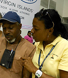 Celia Victor (right), leader of the project medical team, talks to a client.