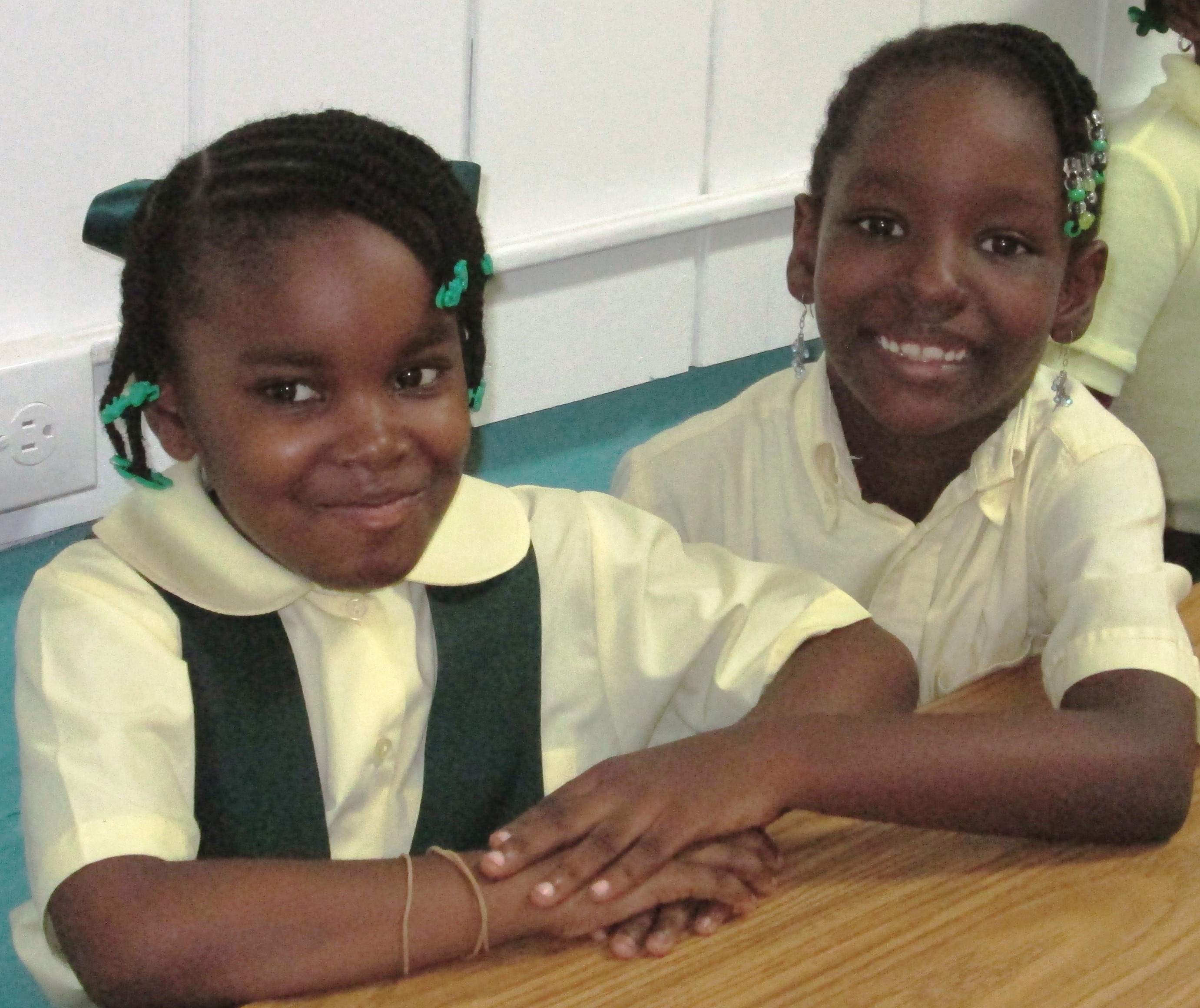 Jada JnPhillips, 6, and Jade Rawlins, 7, are all smiles on their first day as second-graders at Guy Benjamin School.
