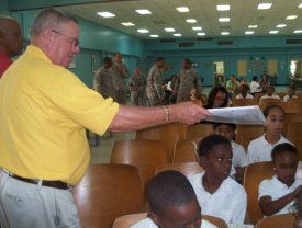 Ralph Collins (left) of Rotary Mid Isle passes out planners.