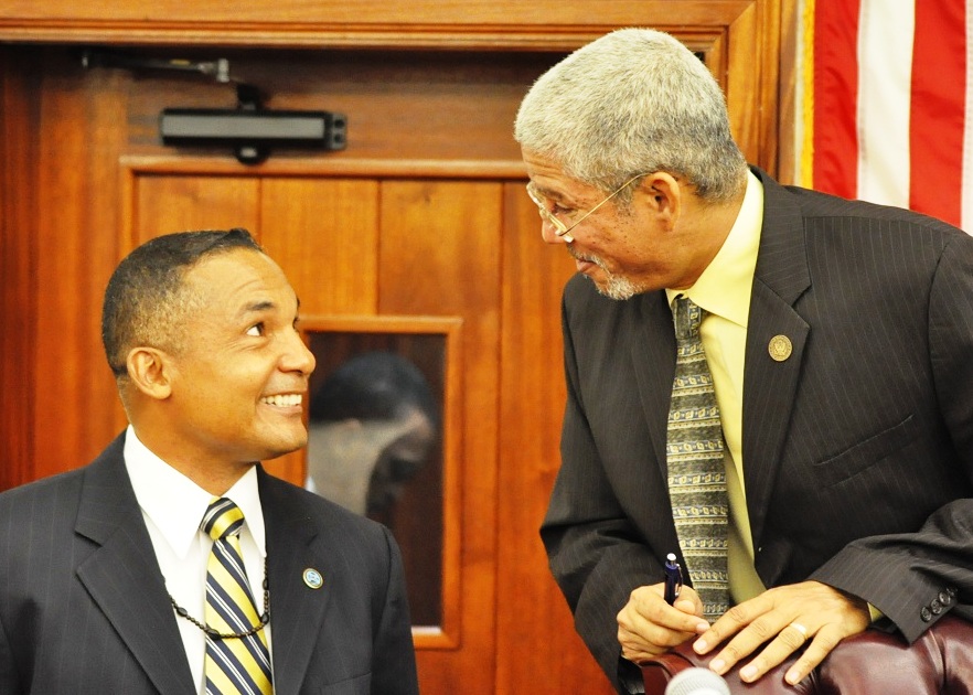 Sen. Louis Hill and Senate President Ronald Russell conferring during Tuesday's Senate session (photo courtesy of Barry Leerdam).