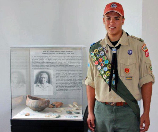 Boy Scout Troop 227’s newest Eagle Scout, Ricardo 'Danny' Nieves, stands in front of the display case he put together for his project.