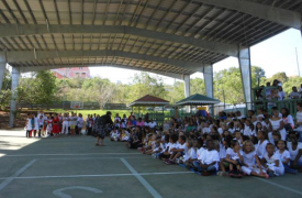 Montessori students perform under "solar awning."