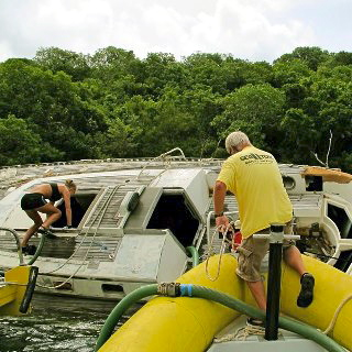 Capt. Alan Wentworth on site of a boat salvage operation.