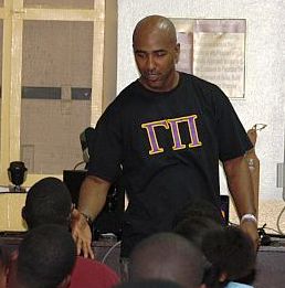 Omega Psi Phi member Damien Goins speaks to students Monday about setting and realizing their goals.