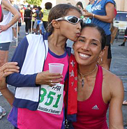 Top finisher Ruth Ann David accepts congratulations from daughter Shaiah David.