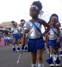 Parades are serious business for tiny twirlers from the St. Croix Majorettes.