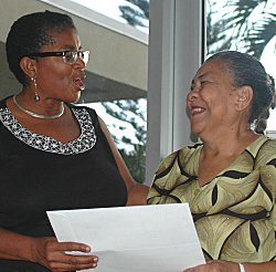 Judy King-Edmeade (left) honored reading advocate Gwendolyn Blyden during Sunday's annual meeting. 