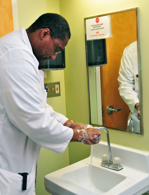 Dr. Angel Lake, head of infection control at JFL Hospital, washes his hands. (Photo courtesy of VIMI)