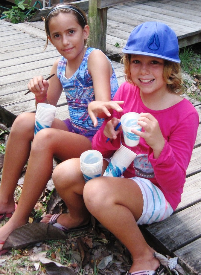 Ananada Hernandez and Lily Margo Francis, both 10 and from St. John, get cups ready for the gardening project.
