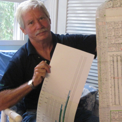 Dave Teichmann holds up detailed records he has kept of turtle hatches.