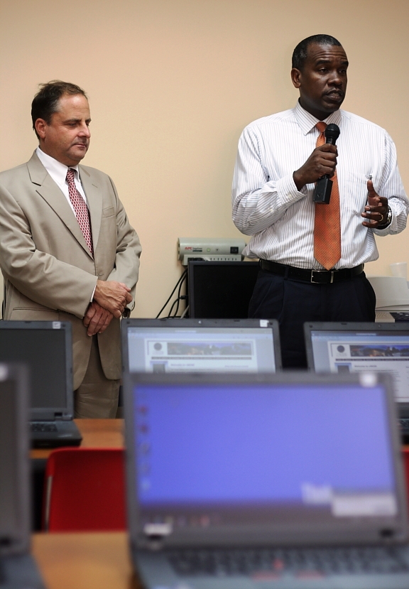 President of viNGN Larry Kupfer and Labor Commissioner Albert Bryan Jr. unveil the new computer center on St. Croix.