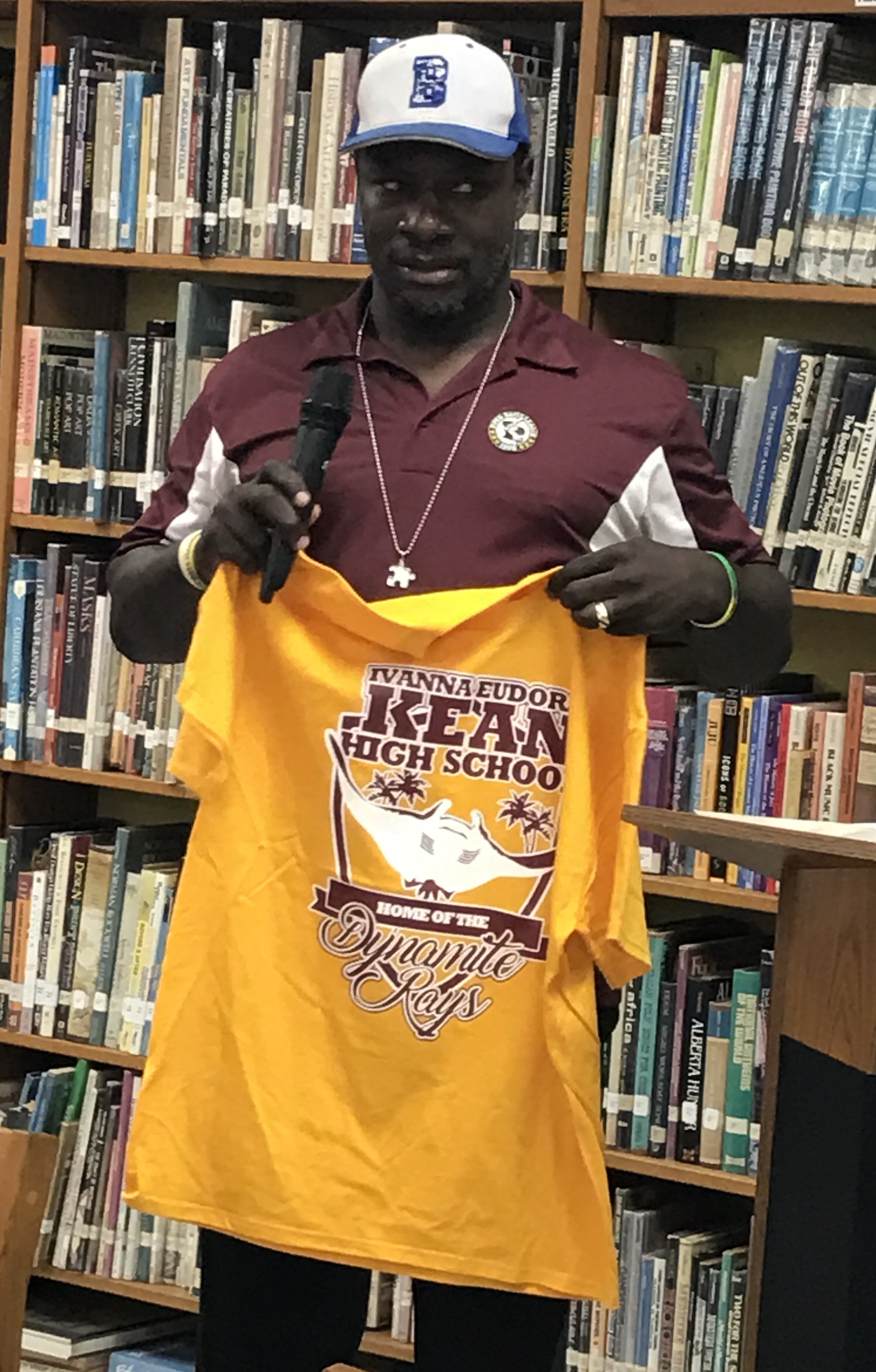 Andrew Dixon accepts Kean High School T-shirt