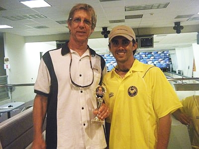 Wally Bostwick (left), captain of the V.I. Source team, and V.I. Now's team captain, Ansen Sligar, have a friendly moment after the bowl off.