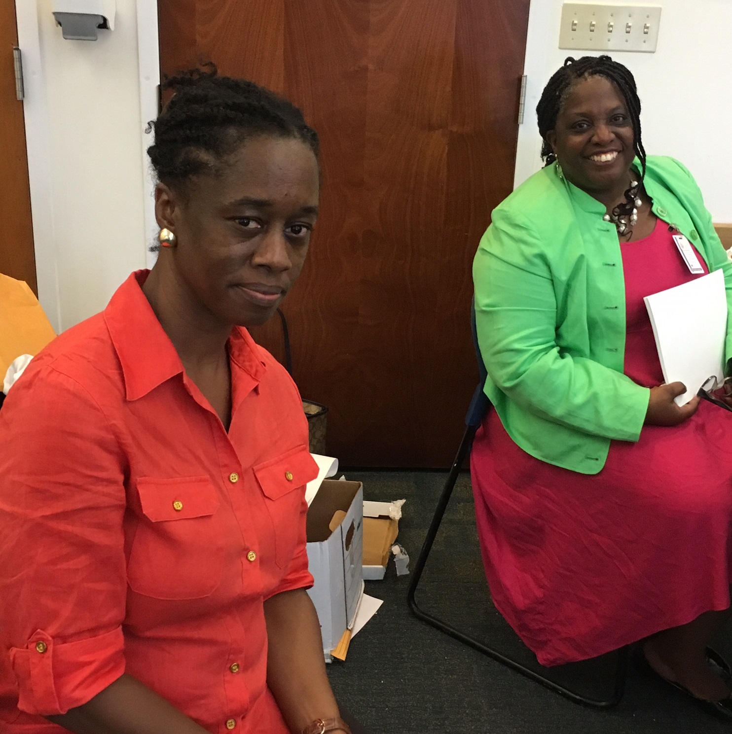 Denise Gomes, program manager, and Valrica Bryson, director of Cultural Education, share a moment at the Culture Bearers Conference on St. Thomas on Sept. 2.