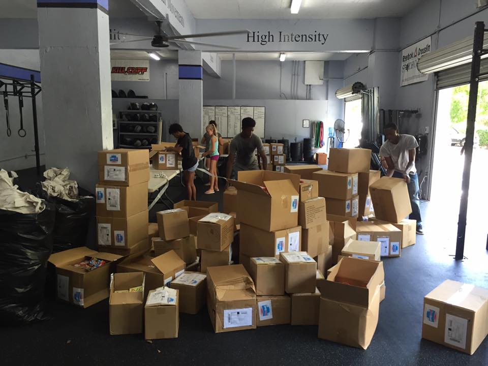 Student volunteers and CFVI supporters assisted the staff in labeling and sorting through books that were then delivered to various locations.