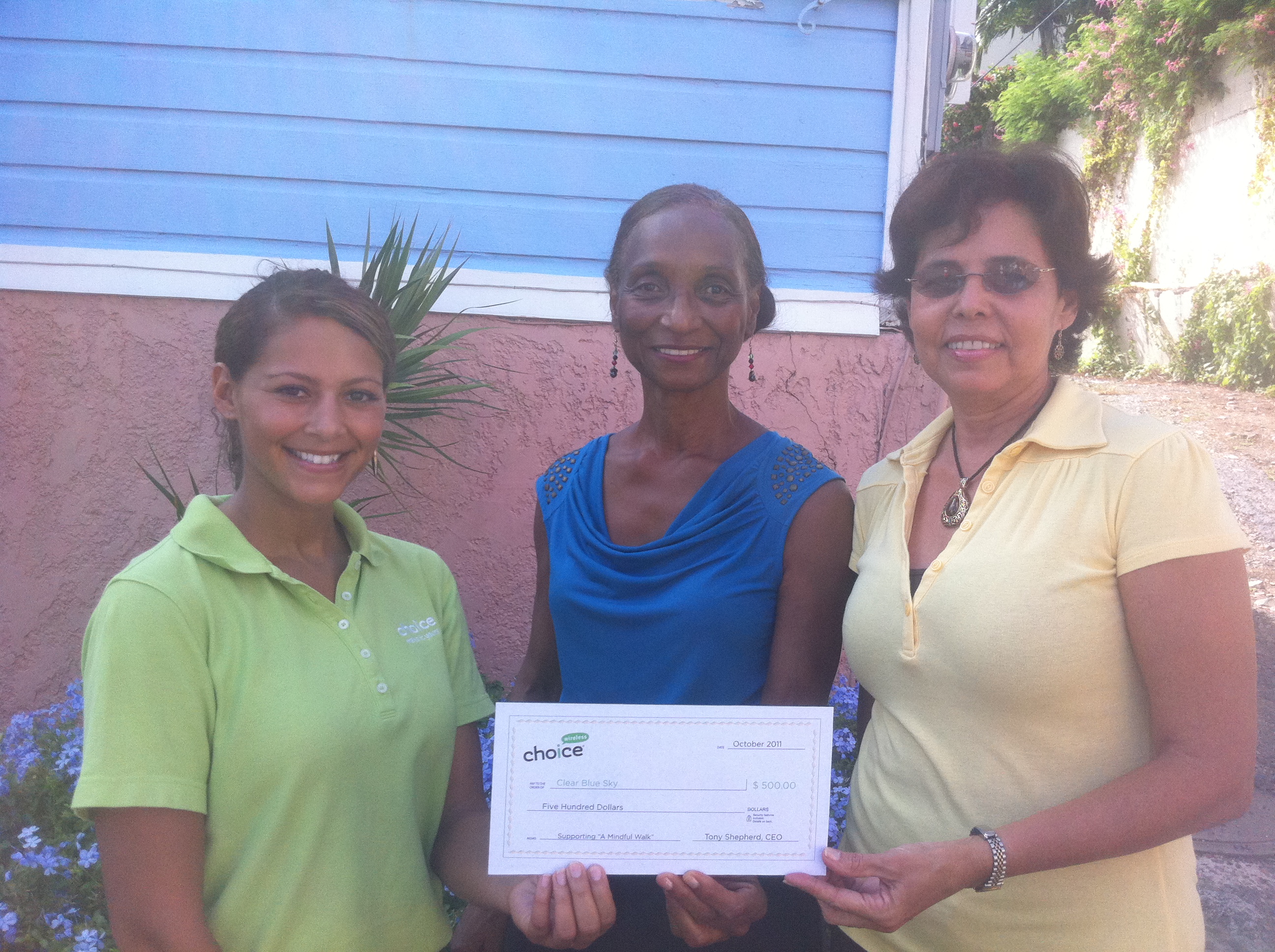 Faith Gregory (Choice Wireless representative), Alrene Monaghan (Clear Blue Sky executive director), and Luz Moron (Clear Blue Sky Board secretary).