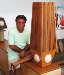 George Hollander with one of his handcrafted light fixtures.