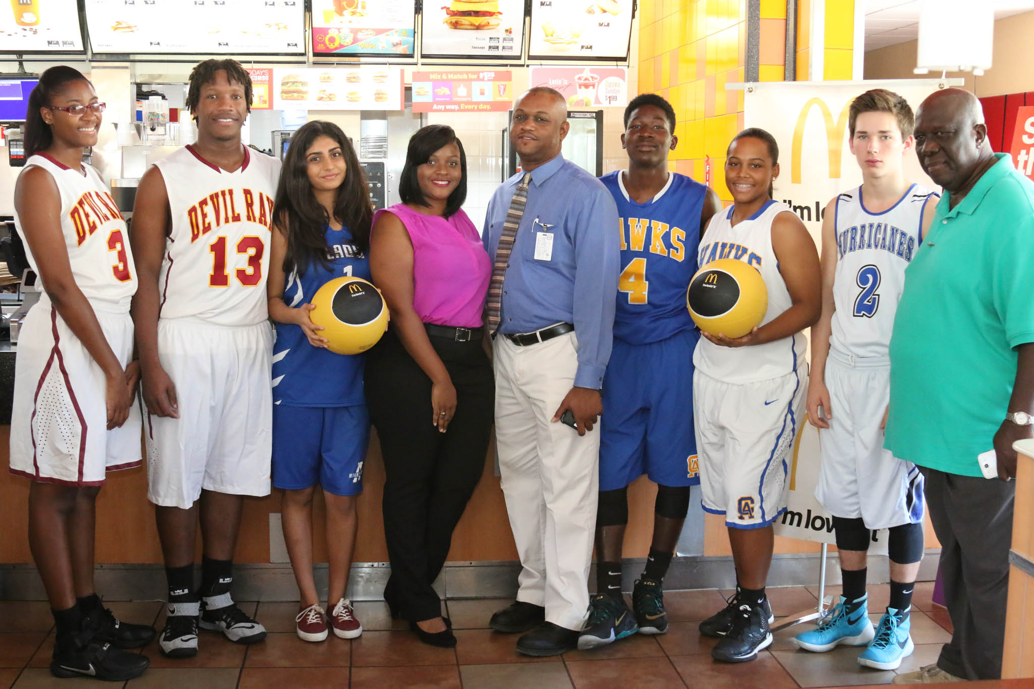  (From left) Haleema Francis and DeQuan Solis of Ivanna Eudora Kean; Mansi Totwani of Antilles School; Alithia Hodge, McDonald's operations supervisor; Mark Daniel of the DOE; Robelto James and Rhea Benjamin of CAHS; Ethan Lysiak of Antilles School; Buddy Kennings, commissioner of the Interscholastic Athletics Association.