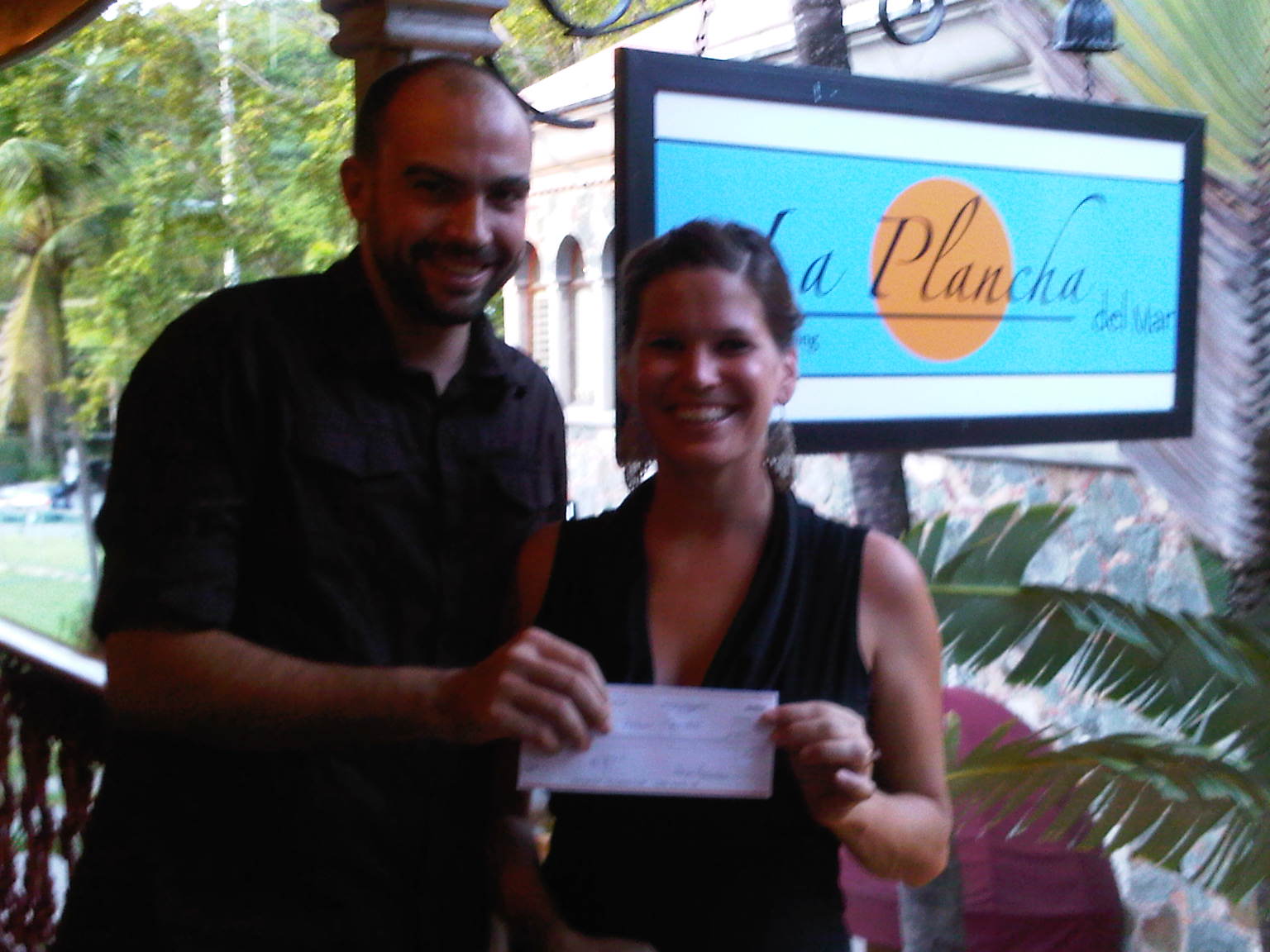Pictured are Jason Howard, co-owner of La Plancha, and Holly Chipman, team captain