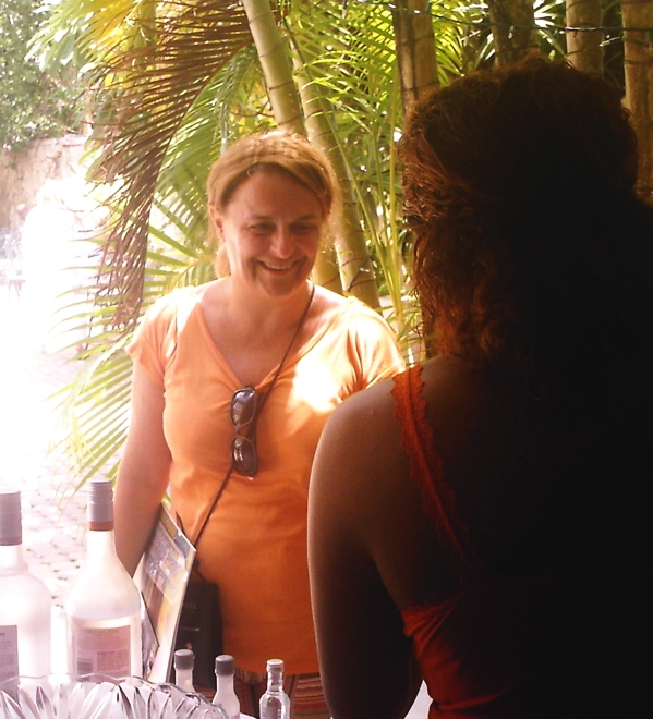 Silvia Brunetti of Bologna, Italy, gets a sample of Cruzan Rum from Shima Moolenaar.