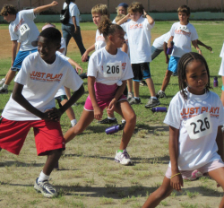 Kids warm up for Just Play Day.