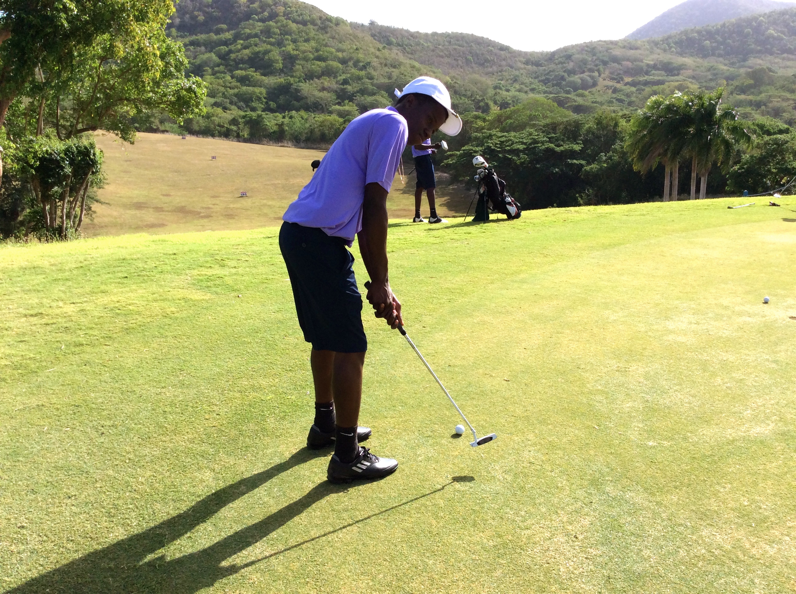 Keshawn Peets golfing at the Caribbean Golf Association Junior Championships 