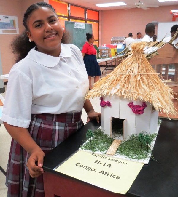 Living in the Congo. Nayellis Saldana shows off the green home she created as part of a Homes for Humanity project.