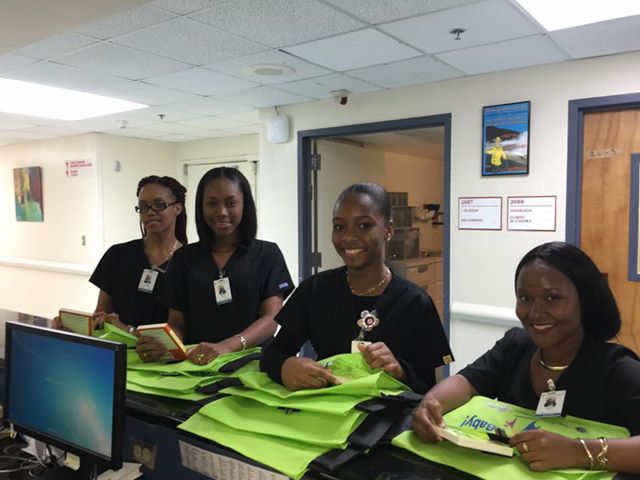 Nurses at Juan F. Luis Hospital with CFVI hospital bags and books that will be given to children at the hospital.