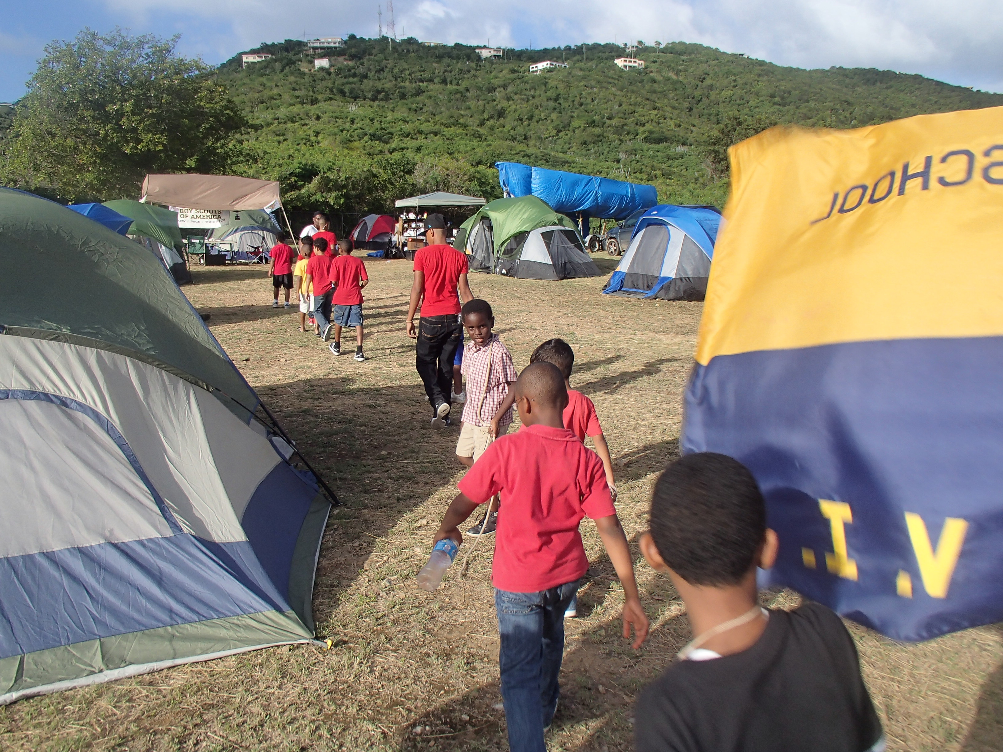 Scouts walk through their camp to a knot-tying lesson. (photo: Jimmy Loveland)
