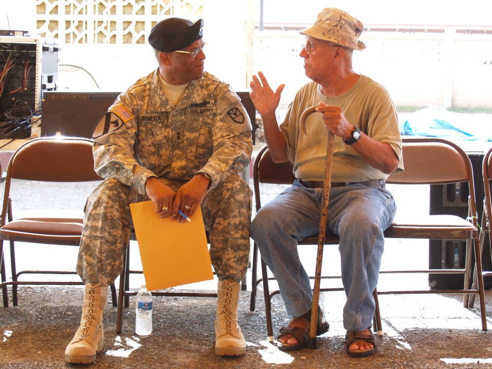 Maj. Gen. Renaldo Rivera talks with Korean-era veteran Jules Olive
